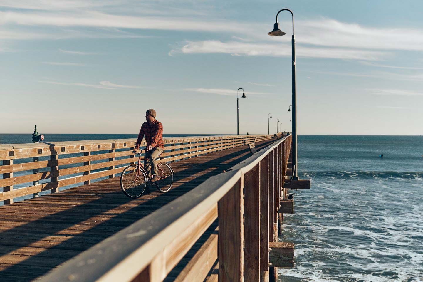 Aaron Jackson riding a bike on a pier